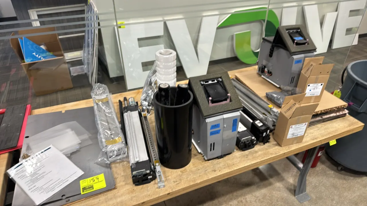 Package lot of commercial printer components. Includes dispenser modules, roller assemblies, cleaning units, developer powder, toner bottle, build pla