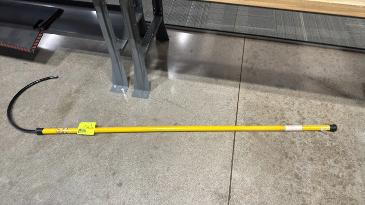 Honeywell Salisbury 24401-ES fiberglass rescue hook hot stick. Features an insulated yellow fiberglass shaft, coated rescue hook, and rubber end cap.