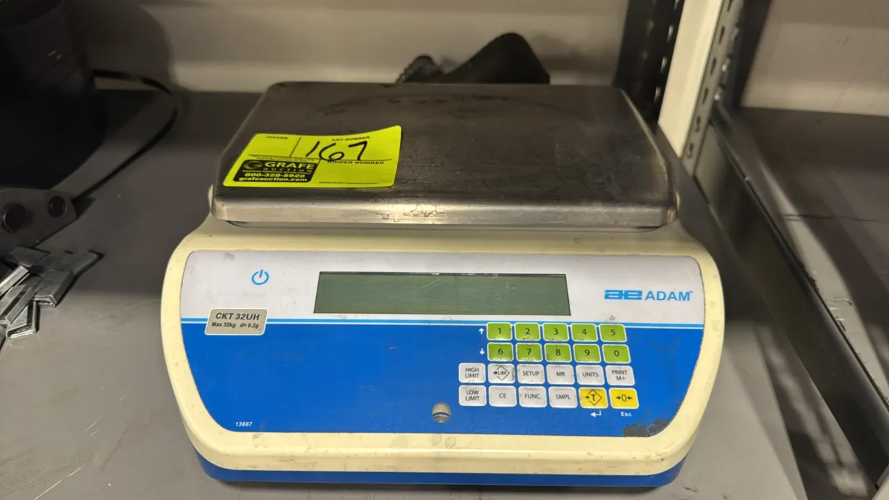 Adam Equipment CKT 32UH electronic bench scale. Features a stainless steel weighing pan, digital display, and integrated numeric keypad. Capacity: 32k