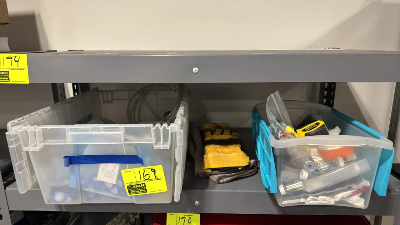 Assorted laboratory supplies and tools. Includes Stanley 8m/26' tape measure, adhesive tape, glass sample vials, wash bottle, box of black nitrile glo