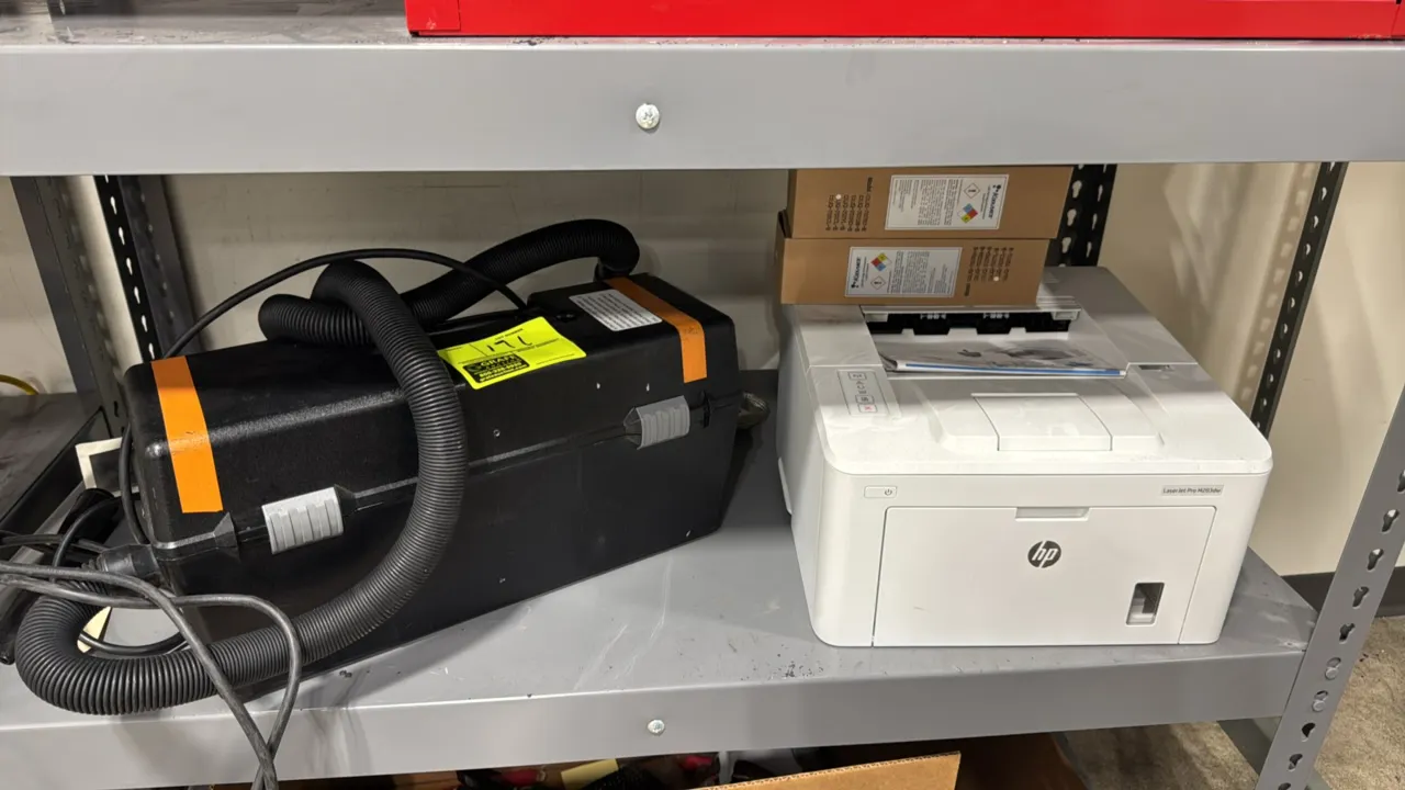 HP LaserJet Pro M203dw monochrome laser printer with portable service vacuum. Vacuum features a flexible hose and power cord. Lot includes (2) boxes o