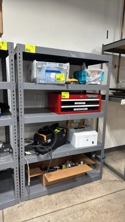 Metal 5-tier shelving rack. Features boltless steel frame construction with five solid metal shelf levels. Finished in gray. 4' x 2' x 6'. Contents no