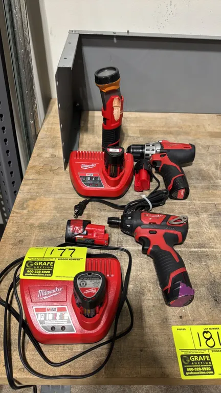 Milwaukee M12 cordless tool package. Includes cordless screwdriver, drill/driver, work light, (2) M12 battery chargers, and (7) M12 12V lithium-ion ba