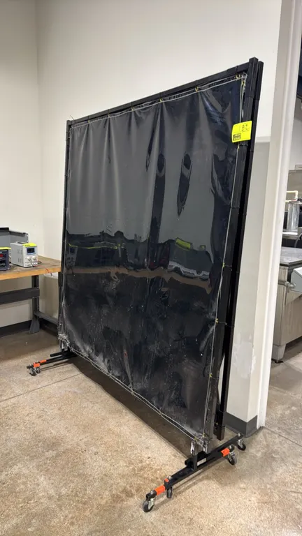 Steiner Industries 322-6X6 vinyl welding screens. Features vinyl shield curtains with brass grommets mounted on black metal frames. Dimensions: 6' x 6