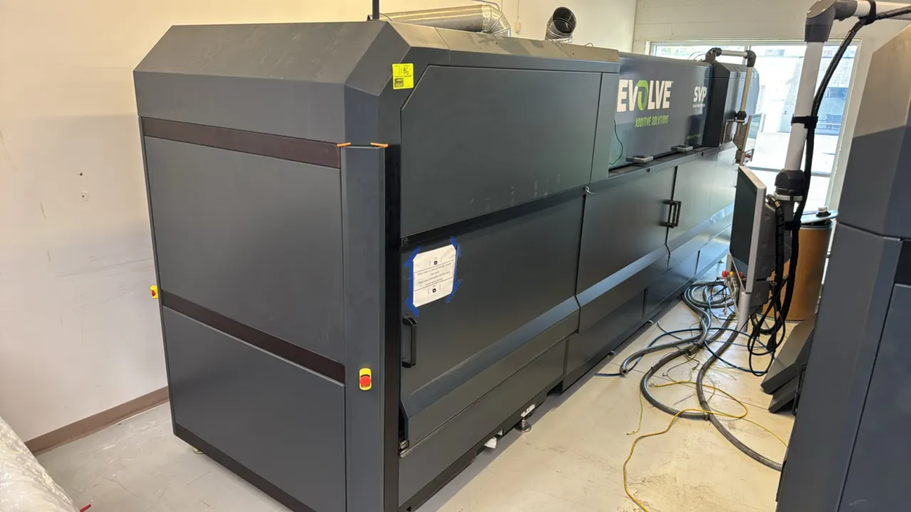 Evolve Additive Solutions SVP 3D printer. Features STEP technology, multi-station build assembly, internal ventilation ducting, status stack light, an