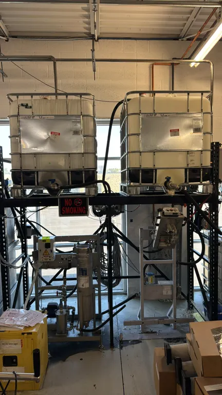 2022 MKR Metzger GmbH BEUTELFIL stainless steel bag filtration station. Includes fluid transfer filling station, (2) 275-gallon IBC tanks, and pallet