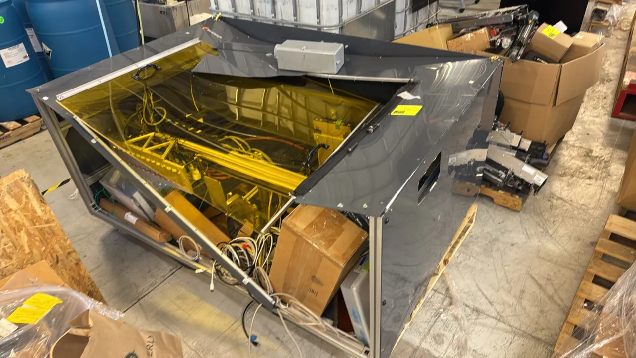 Stratasys custom laboratory equipment. Features an aluminum extrusion frame, tinted viewing cover, internal linear motion assemblies, wiring, and asso