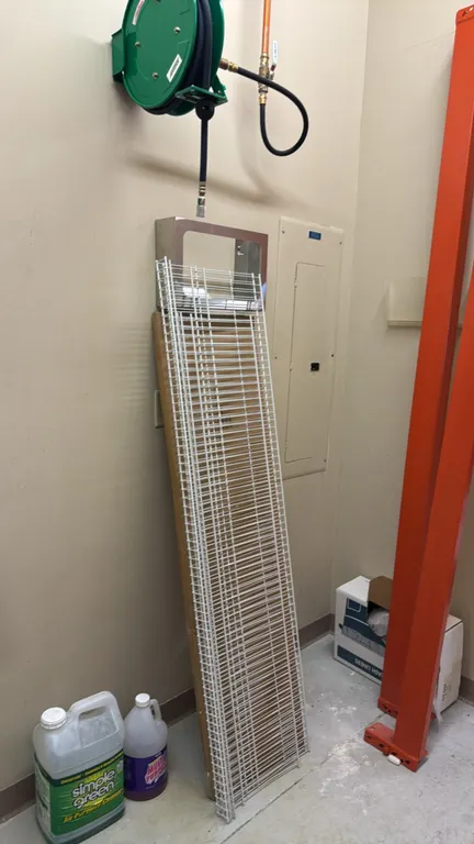 Package lot of assorted warehouse and maintenance items. Includes (2) 8'L pallet racking cross beams, white wire shelving panels, Speedaire wall-mount