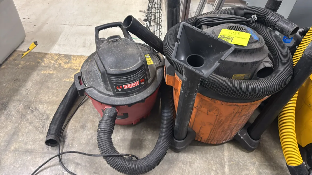 Ridgid and Craftsman wet/dry vacuums. Includes (1) Ridgid wet/dry vacuum with flexible hose, extension wands, and attachments, and (1) Craftsman 2.5 H