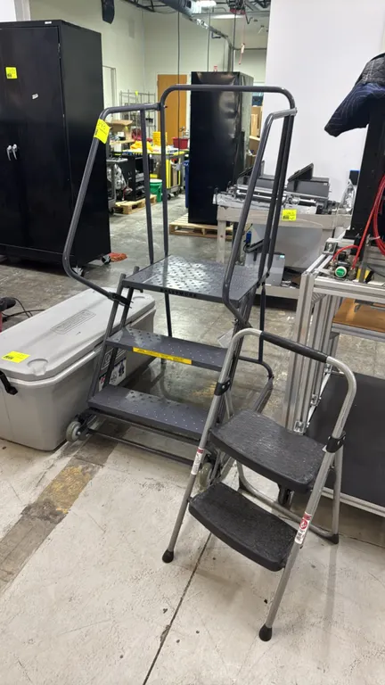 Ballymore portable 3-step rolling stock ladder with collapsible 2-step ladder. Stock ladder features perforated slip-resistant treads, top work platfo