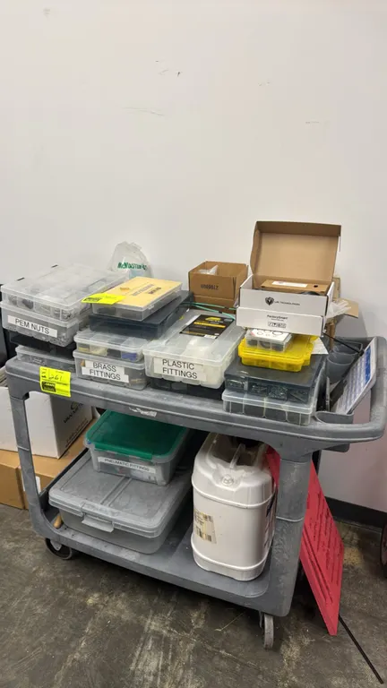 Package lot of assorted hardware, fittings, and shop supplies. Includes compartment organizer cases containing PEM nuts, brass fittings, plastic fitti