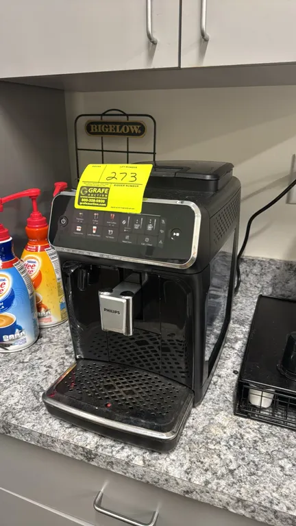 Philips espresso and coffee machine. Features touch control panel with selections for espresso, coffee, iced coffee, cappuccino, latte macchiato, and