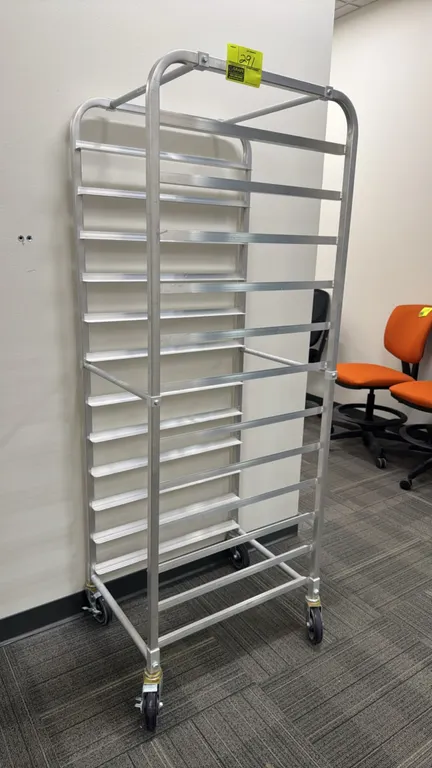 Full-size aluminum front-load speed rack. Features 20-tier runner capacity for sheet pans. Mounted on swivel casters.