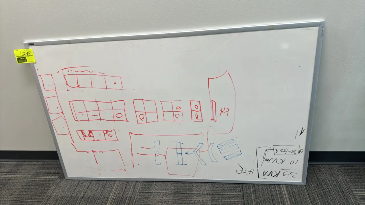 Quartet dry erase board. Features an aluminum frame. 5' x 3'.