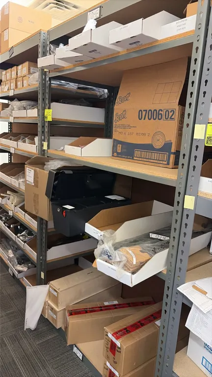 Light-duty shelving unit. Features particle board decking. 48" x 24" x 84". Includes contents: assorted parts inventory, hardware, Accuride drawer sli