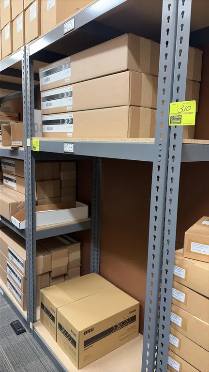 Light-duty storage racking with Kodak NexPress supplies. Features steel frame construction with particle board shelf decking. 48" x 24" x 84". Include