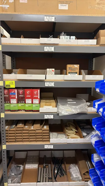 Light-duty storage racking. Features steel frame construction, adjustable shelves, and particle board decking. 48" x 24" x 84". Contents not included.