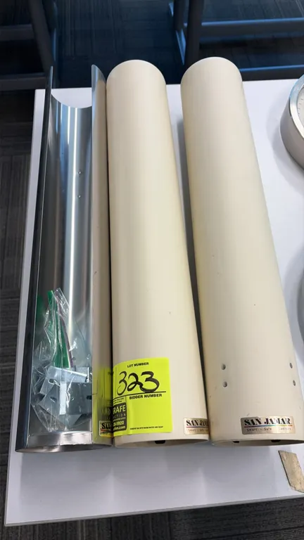 San Jamar cup dispensers. Includes (2) tube dispensers and (1) stainless steel bracket with mounting hardware. 2'L.