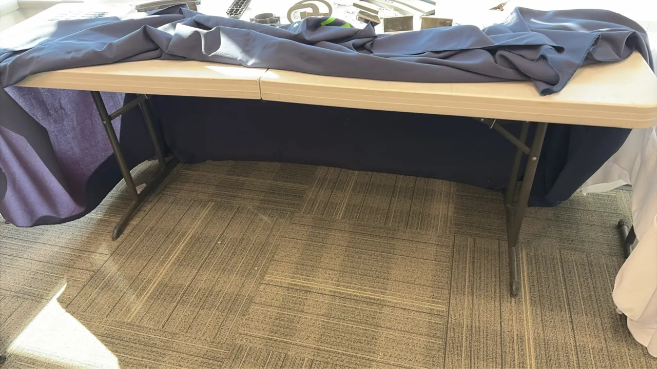 Lifetime polyethylene fold-in-half folding table. Features a molded plastic top and folding metal legs. 6'L. Contents and tablecloth not included.