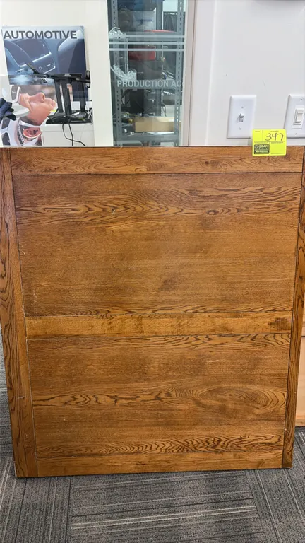 Assorted wood table tops. Features mixed styles and sizes, including framed oak-finish tops and distressed tops.
