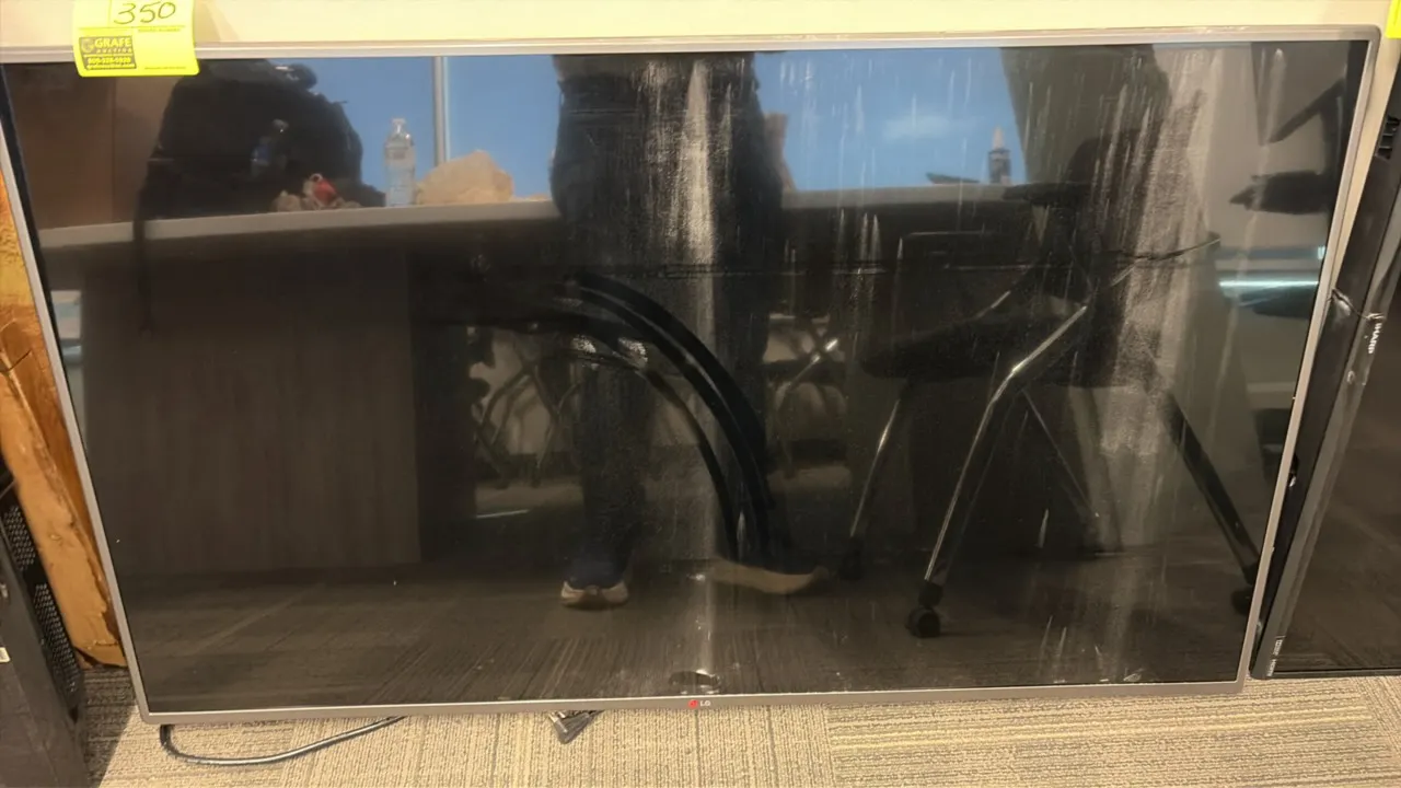 LG 55" flat screen television. Features slim bezel design and power cord. Note: Stand and remote not included.