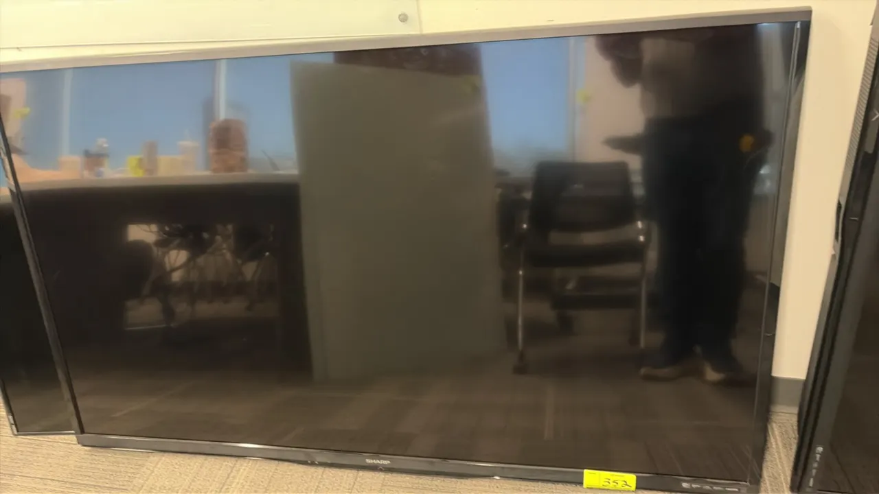Sharp LC-70LE650U 70" flat screen liquid crystal TV. S/N: 407863801. Electrical: 120V, 60 Hz, 228W.