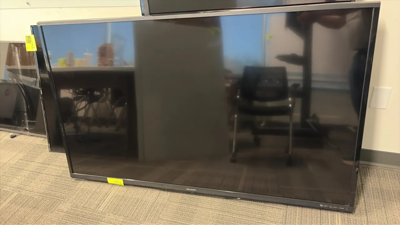 Sharp LC-70LE650U 70" flat screen television. Features liquid crystal display. Electrical: 120V, 60 Hz, 228W. S/N: 407863802.