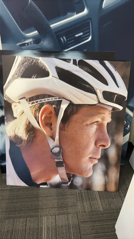 Assorted photo display boards. Includes cyclist portrait, automotive interior with "AUTOMOTIVE" header text, and dental panoramic X-ray image. Rigid p