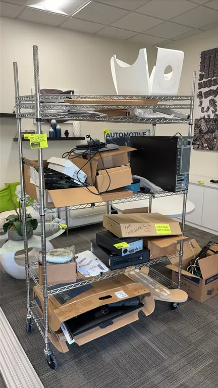 Chrome 6-tier wire shelving rack. Features adjustable wire shelves. 48" x 18". Mounted on casters. Contents not included.