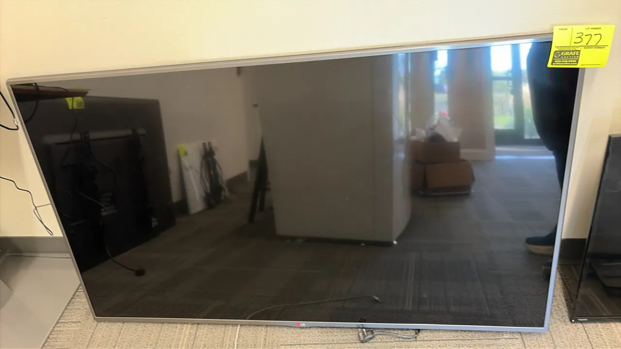 2014 LG 55LY540S-UA 55" flat screen TV. Features slim silver-tone bezel. S/N: 406RMEN0J420. Electrical: 100-240V, 50/60 Hz, 1.3 A.