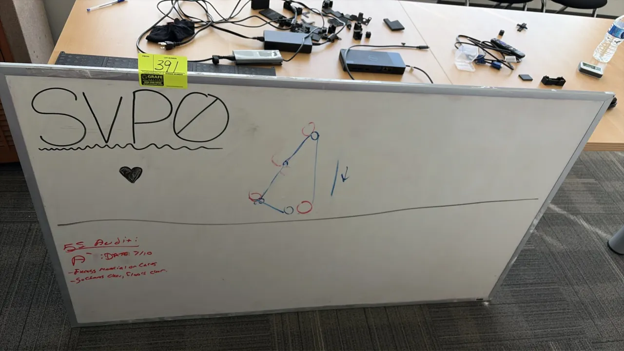 Dry erase whiteboard. Features an aluminum frame. 5' x 4'. Background items not included.
