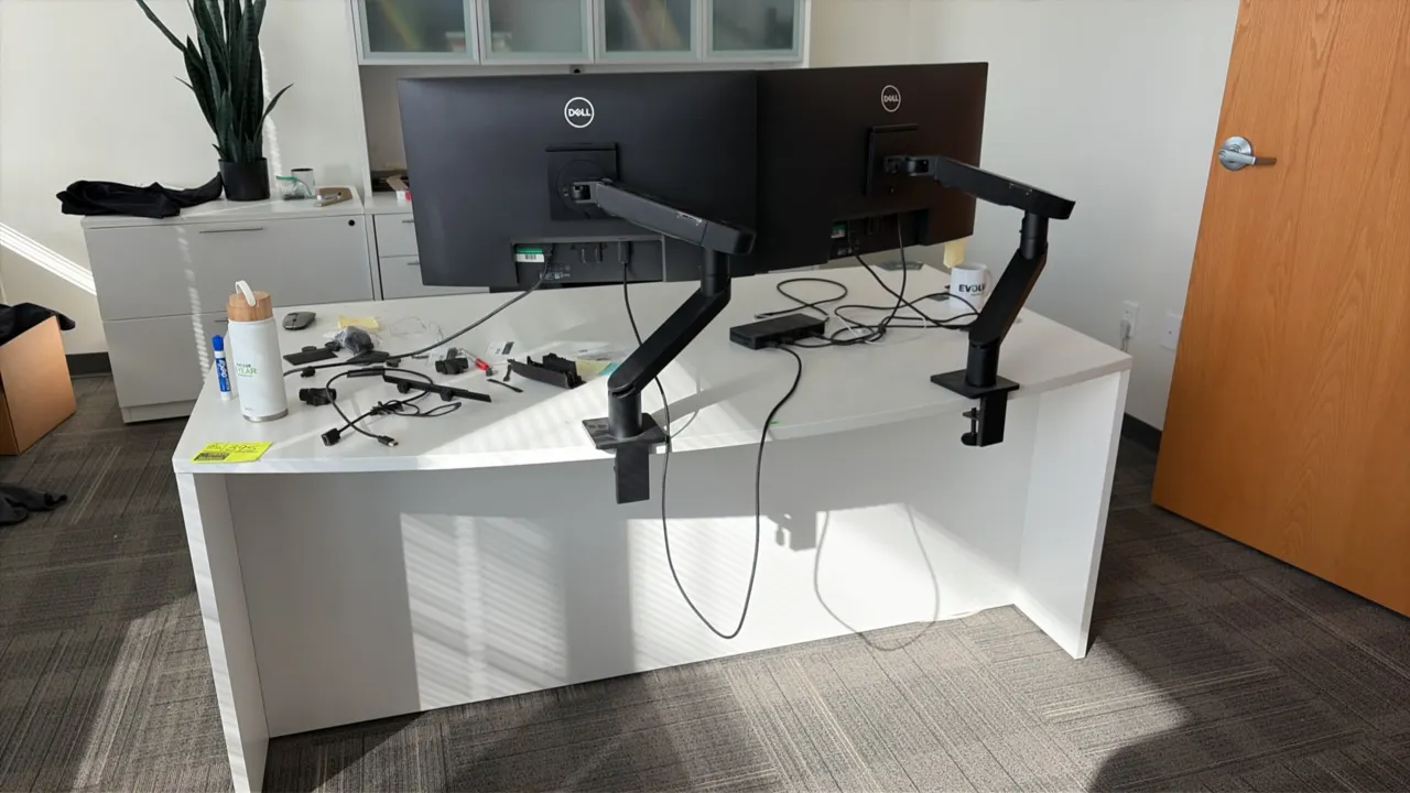Laminate office suite. Includes 6' desk with dual pedestals, 6' credenza with overhead hutch featuring frosted glass doors, (2) 24" Dell monitors with