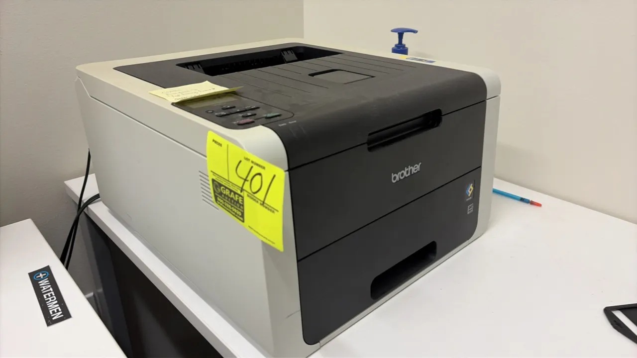 Brother color printer. Features front control panel with LCD screen, Wi-Fi connectivity, and pull-out paper cassette tray.