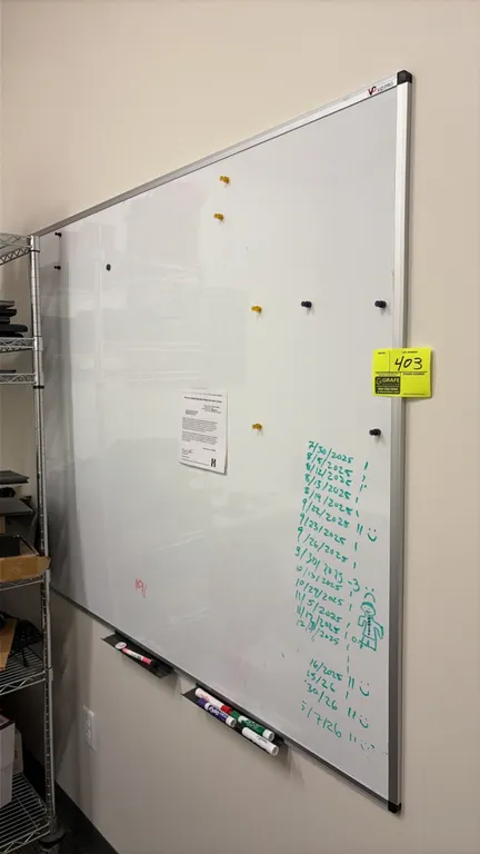 VIZ-PRO magnetic whiteboard. Features an aluminum frame, protective corner caps, and attached marker trays. 4' x 4'. Wall-mounted. Markers, magnets, a