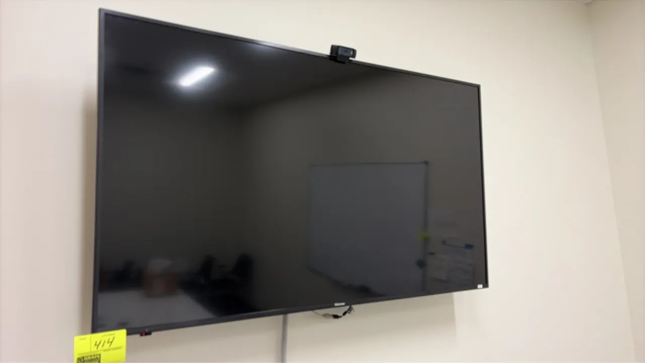 Hisense 58" flat screen TV. Includes wall mounting bracket, mobile adjustable table on casters, keyboard, and remote.