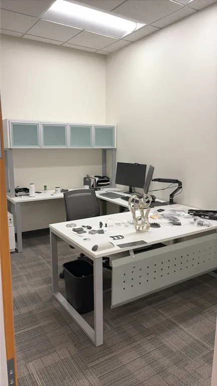Modern laminate office workstation suite. Includes 72" x 36" desk table with modesty panel, 48" return, 6' credenza with overhead hutch, 2-drawer late