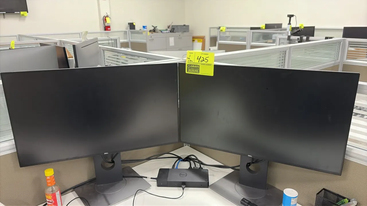 Dell 24" computer monitors. Features slim bezel screens and adjustable desk stands. Docking station and desk accessories not included.