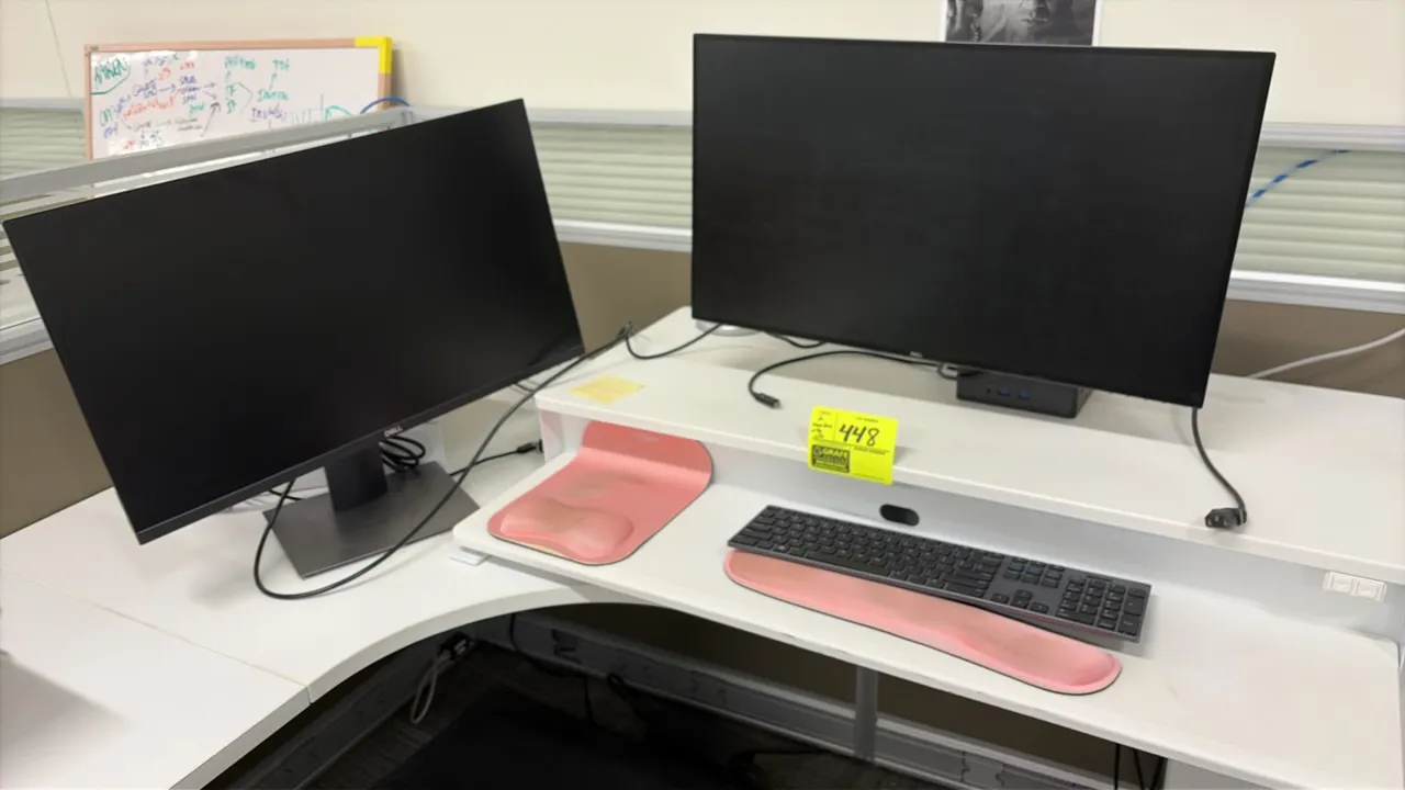 Dell computer workstation lot. Includes (2) 24" Dell monitors and a desktop sit-stand lift station with lower keyboard tier. Also includes keyboard an