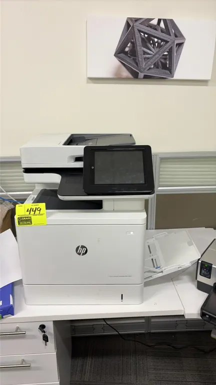 HP Color LaserJet Enterprise MFP M577 multifunction printer and copier. Features automatic document feeder, flatbed scanner, color touchscreen control