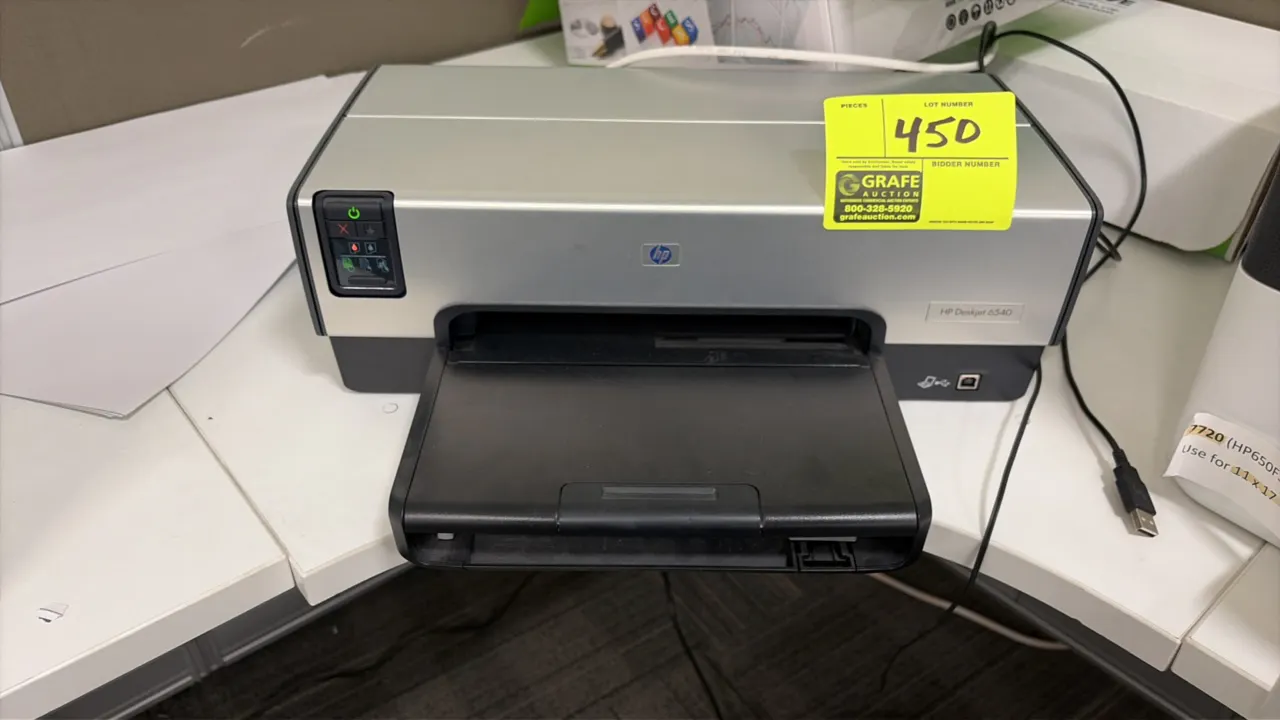 HP DeskJet 6540 color inkjet printer. Features front control panel with status indicators, fold-out input and output paper tray, and USB connectivity.