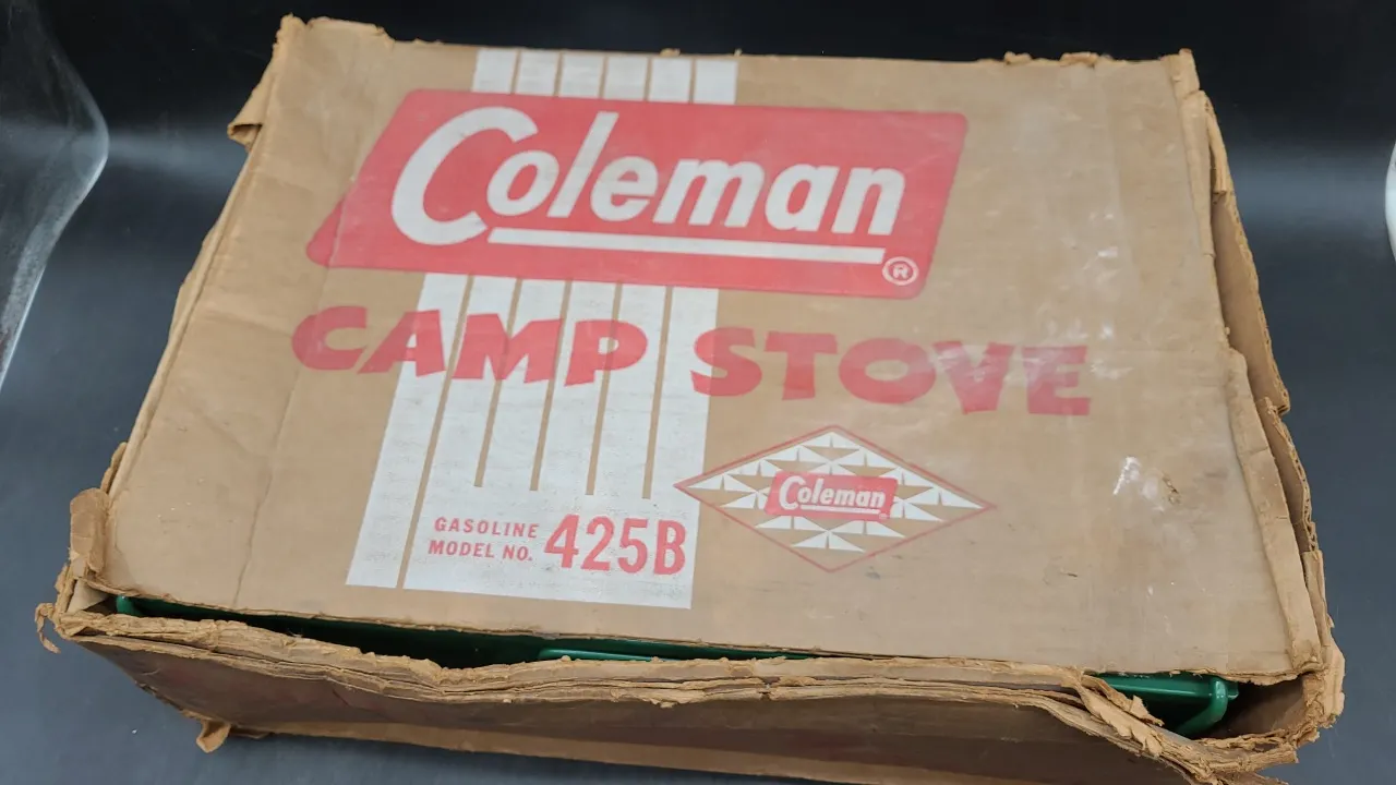COLEMAN CAMP STOVE with contents