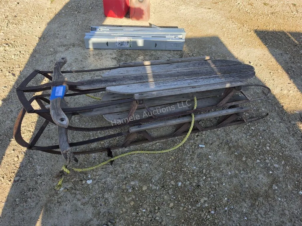 2 old wooden sleds