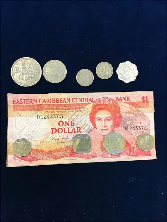 Caribbean - coins were taped to the bank note
