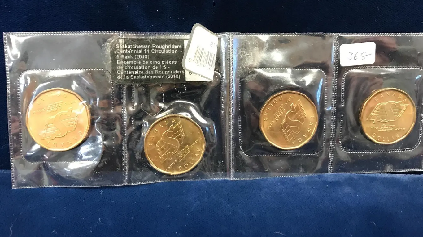 four 2010 Roughrider Loonies uncirculated, 1 money