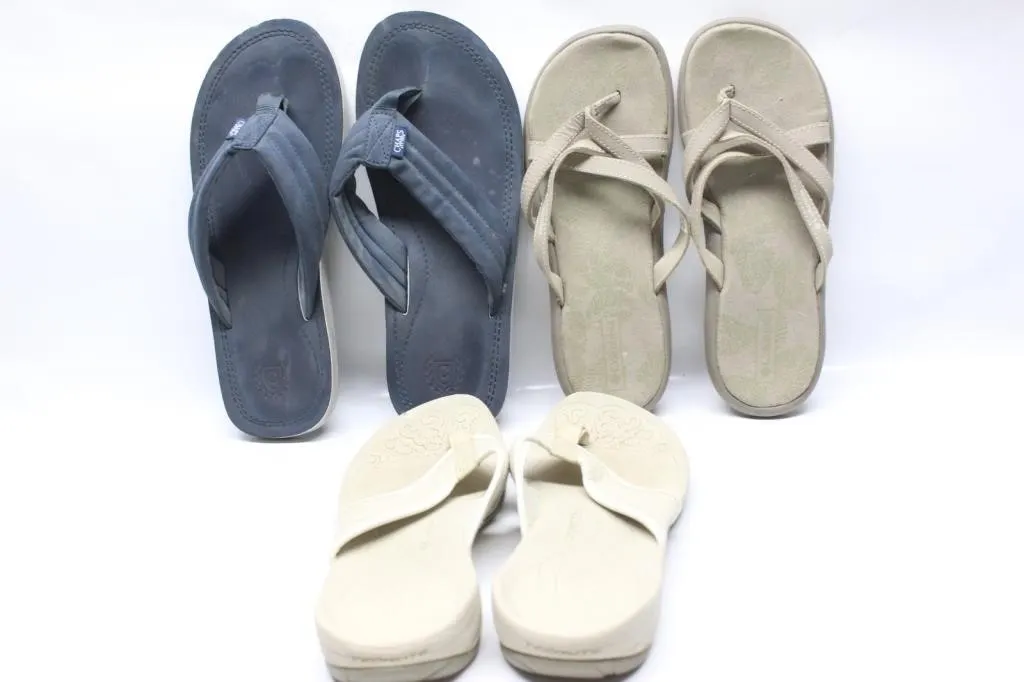 Three pairs of men's and women's flip flop sandals