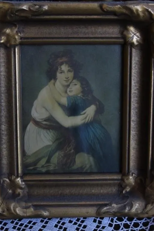Framed Print of Mother and Child Embracing