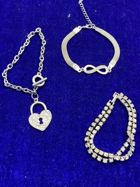Three Silver-Tone Bracelets - Heart Lock, Infinity