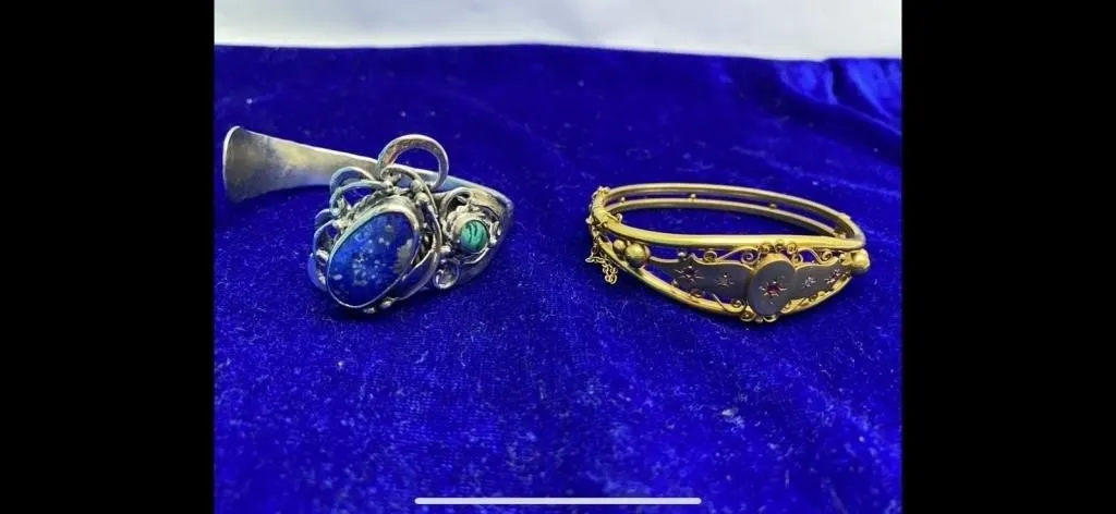 Silver gemstone ring and ornate gold bangle