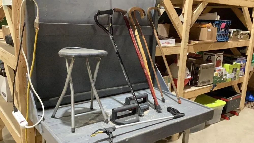 CLEAR TOTE W/ASSORTED CANES + FOLDING STOOL