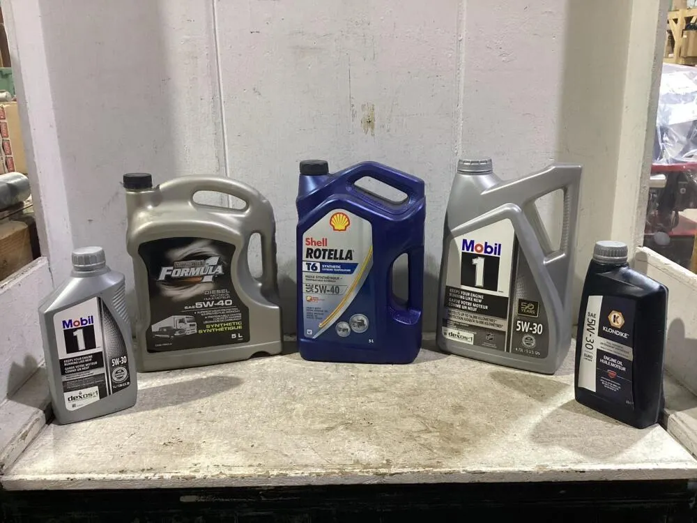 SHOP BOX OF MIXED ENGINE OILS